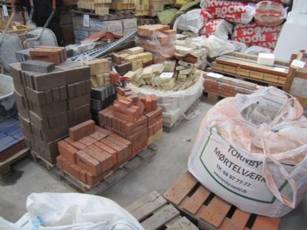 Various bricks and mortar in bags and misc. accessories around. 10 pallets, pallets supplied