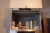 High cabinet with hot beverage machine / espresso (coffee + cacao), type Miele EGW 4060-14 EDST/RO1. Contains particular coffee grinder. Waste bins in the lower section.