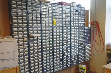 Approximately 23 range drawers on the wall containing various components, etc.