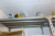Steel Shelving with content wheels + chain + parts + exhaust pipe supports, etc.