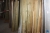 Various pressure-treated wood in rack, including boards, planed