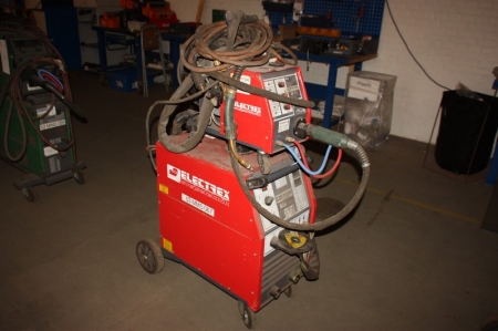Welding rectifier, Electrex MIG 405 + wire feed box, AF 75.3, on wheels + welding cable welding + handle + manometer. Mounted in a frame on wheels
