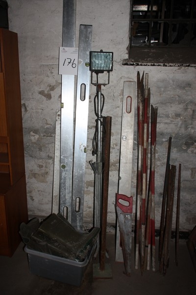Miscellaneous at the wall, including leveling boards, marker poles, box of rubber boots, etc.