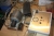 Miscellaneous machine parts, cutting tools, etc. on table