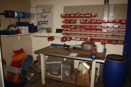 Work Bench with vise, approx. 1600 x 800 mm + panel for assortment boxes + assortment boxes with content + shelf with content + stand for cable reels containing power cable reels + shelf with various electric parts + panel with content + parts in the corn