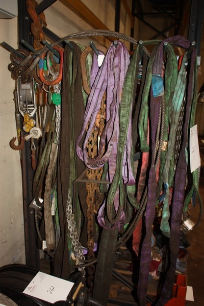 Various lifting chains, lifting straps, wire lever blocks etc. on pallet racking