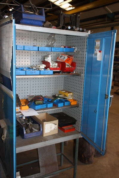 Tool cabinet with content including fuses, various electrical parts