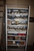 Tool cabinet with content including parts for electrical appliances, relays, fuses, holders, etc.