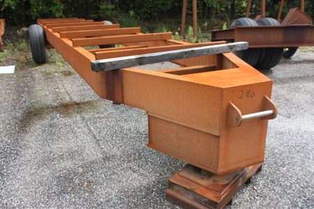 Heavy duty trailer with bracket for wheel loader. Total length about 11 meters