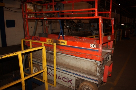 Scissor Lift, Skyjack SJ 3220, S/N 603548, Solid wheels. Max. 3 people. Working height 8 meter, Extendable platform with capacity of 363 kg, elecctrical driven included charger