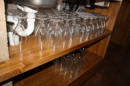 Various glasses on shelves and under the disc