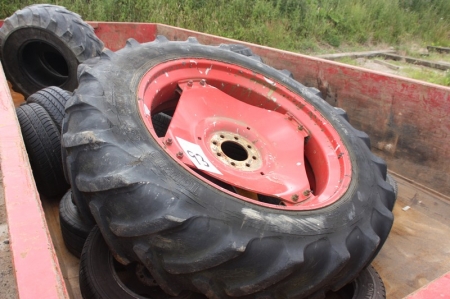 Various used wheels and tires in container