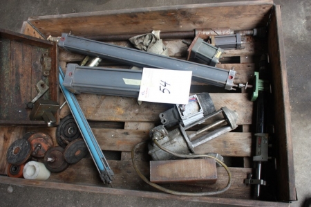 Pallet with various contents, including air cylinders, machine bases, etc.