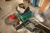 Various items on the floor, including gaskets, grease gun, cutting discs, etc.