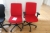 2 red office chairs + 1 black office chair