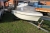 Boat + trailer with anchor. Engine: condition unknown. Sold by private individual. Only VAT on fees.