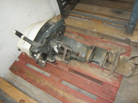 Pallet with Johnson outboard 20 hp and long legs. Condition unknown