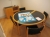Rundt mødebord i bøg med gråt linoleum, 4 stole i formspændt bøg samt reol/skab svarende hertil