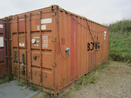 20' shipping container No. APT065124, fair condition with boom lock without the lock itself, with power installations and lighting, work bench with vise and drawer and 5 compartments storage shelves in metal