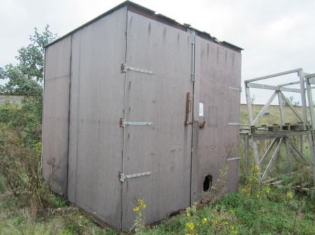Metal sheet shed with brown wooden boards, about 2,6x2,6x2,6 meters