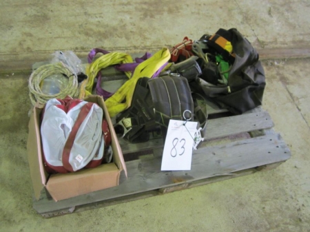 Pallet with overshoes, lifting straps, fall protection, etc.
