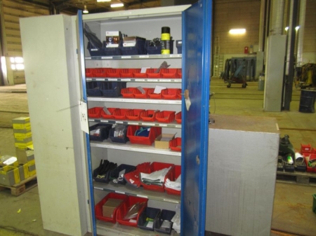 Steel cabinet with 2 doors without a key, containing welding accessories, spare parts, gloves, etc.