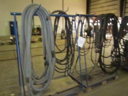 2 pallets racks and suction hoses, pneumatic hoses, welding cables, etc.