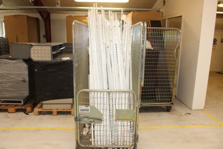 Wall rail for shelves, assorted lengths between about 100 to 200 cm. A total of about 60 pcs. Wire cage supplied