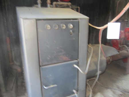 Chip fired furnace, Faust, type Bioflow 129, year 2004 serial no. 150010, power 120 kW, water volume 220 l., With stoker, outfeeder from silo, snails, lock and control panel mm. Buyer must dismount and maneuver out of the boiler room.