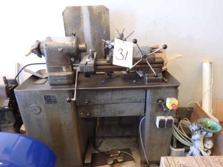 Revolving lathe, Schaublin 102, containing drawers, including steel holders, plates, tongs, etc.