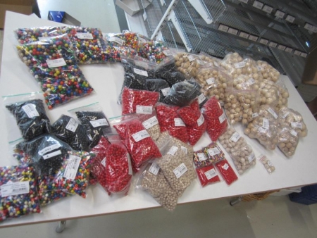Approximately 57 bags of assorted wooden beads, see photos