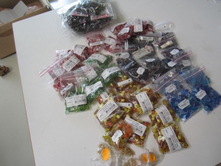 Approximately 40 bags of glass beads Symphony a 100 gram, 10 leather laces