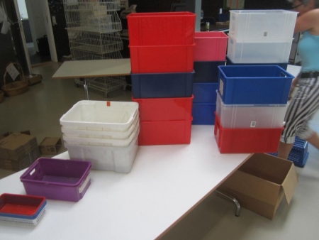 Approximately 25 assorted storage boxes