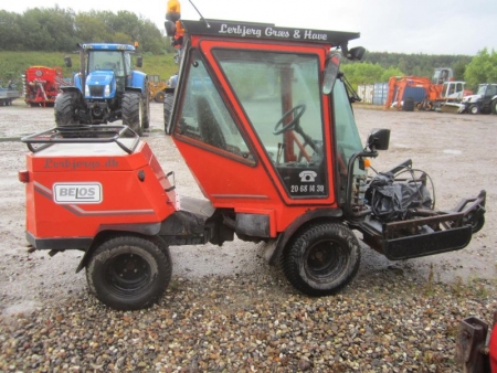 Tool Carrier Belos Transpro, year 1997. hours 3094, with Kubota diesel engine and front-mounted mower with three rotors (top cover MISSING)