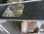Laminatbordplade  med alu-forkant. 200x61 cm, sort med grå nister, med underlimet stålvask cirka48x34 cm, er med skrå ende som kan skæres af og derefter holder den 200 cm i længden. Der medfølger løs not og samlebeslag