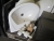 2 pcs sinks in white porcelain, wall-mounted toilet in white porcelain with seat and lid, and assorted tiles etc.