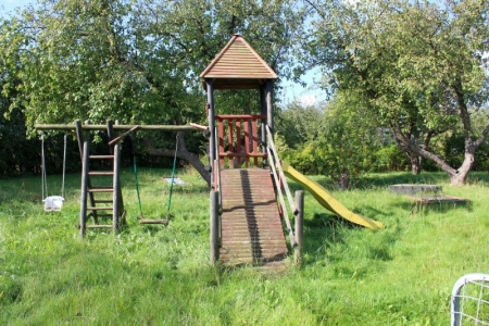 play tower with swings, slides and ladder