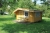 Log cabin with terrace. (1) Furnished with kitchen table with cabinets, bunk bed, sofa, dining table with four chairs. Dimensions: B: 4200 - D 3600 mm - H: 2000 (50 cm overhang the sides) Height to tilt 2550 mm, 'Terrace: 1800 x 4200 mm overhang on the te