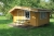 Log cabin with terrace. (1) Furnished with kitchen table with cabinets, bunk bed, sofa, dining table with four chairs. Dimensions: B: 4200 - D 3600 mm - H: 2000 (50 cm overhang the sides) Height to tilt 2550 mm, 'Terrace: 1800 x 4200 mm overhang on the te