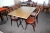 2 tables 122 x 80 cm with 4 chairs. Chairs in steam bent beech and table with surface treated blockbord beech with steld of black larkeret French cast iron