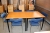 2 Tische, 80x80 cm. + 6 Stühle mit blauem Stoff. (etwas abgenutzt)