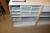 Powered elevating sit / stand desk + high shelf + drawer + roll front + bookcase with letter trays