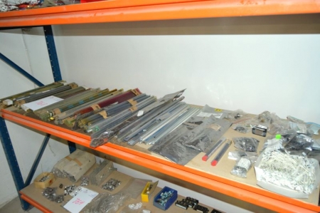 Content on the middle shelf of the pallet rack: various electronics components