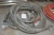 Rubber hose, unused, with coupling. Without indication. Pallet not included