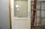 Front door, wood, painted white with double glazing. Studded, without lock cylinder. Wxh frame dimensions, ca. 99 x 209 cm