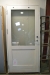 Front door, wood, painted white with double glazing. Studded, without lock cylinder. Wxh frame dimensions, ca. 99 x 209 cm