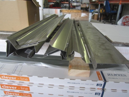 Approximately 10 assorted verge profiles and other coverings in aluminum, 1 box tile binders, various wires, brackets and 3 boxes dowels, 1 box smoking bracket Monier.