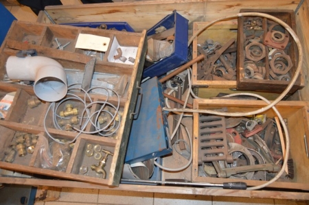 Pallet with various plumbing parts + pallet of used milking equipment, labeled Strangko / Afimilk