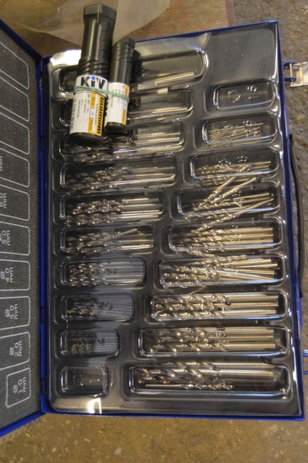 Box with metal drills + plugs + set of spanners in original packaging + clamps etc.