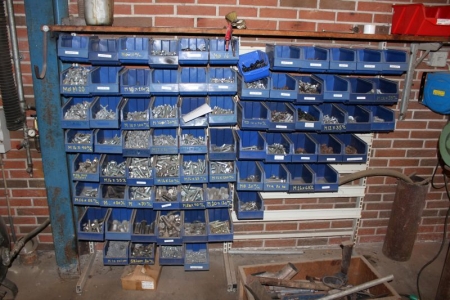 Assortment boxes on a wall containing div. Bolts + nuts etc.